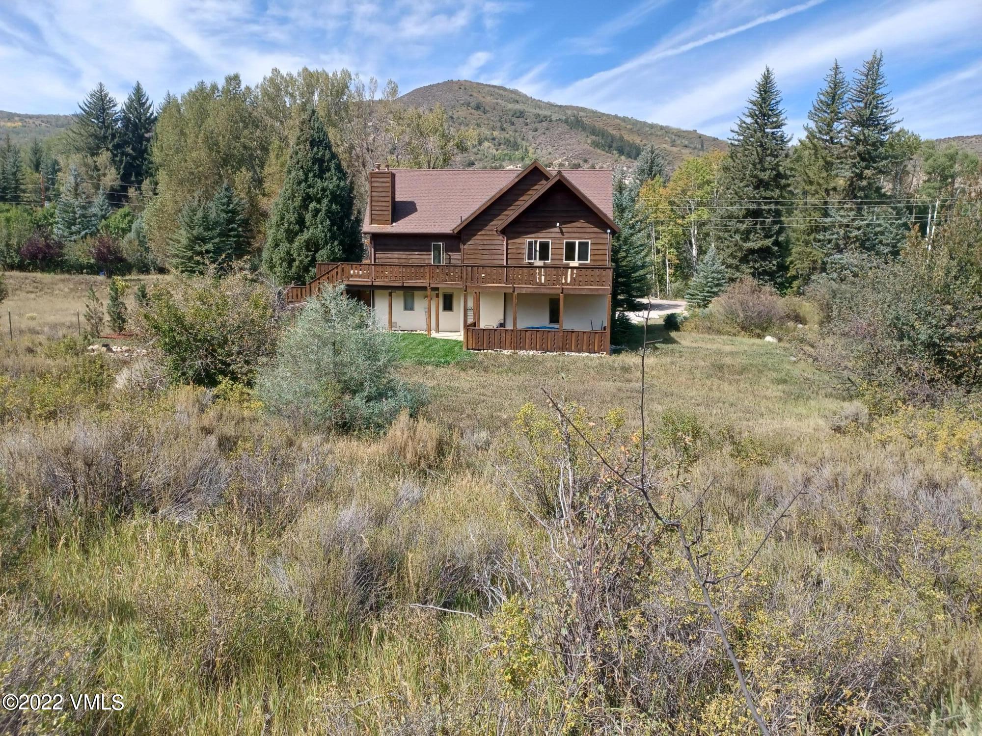 1476 Lake Creek Road Edwards, CO 81632 - Photo 34 of 35 a front view of a house with a yard and trees
