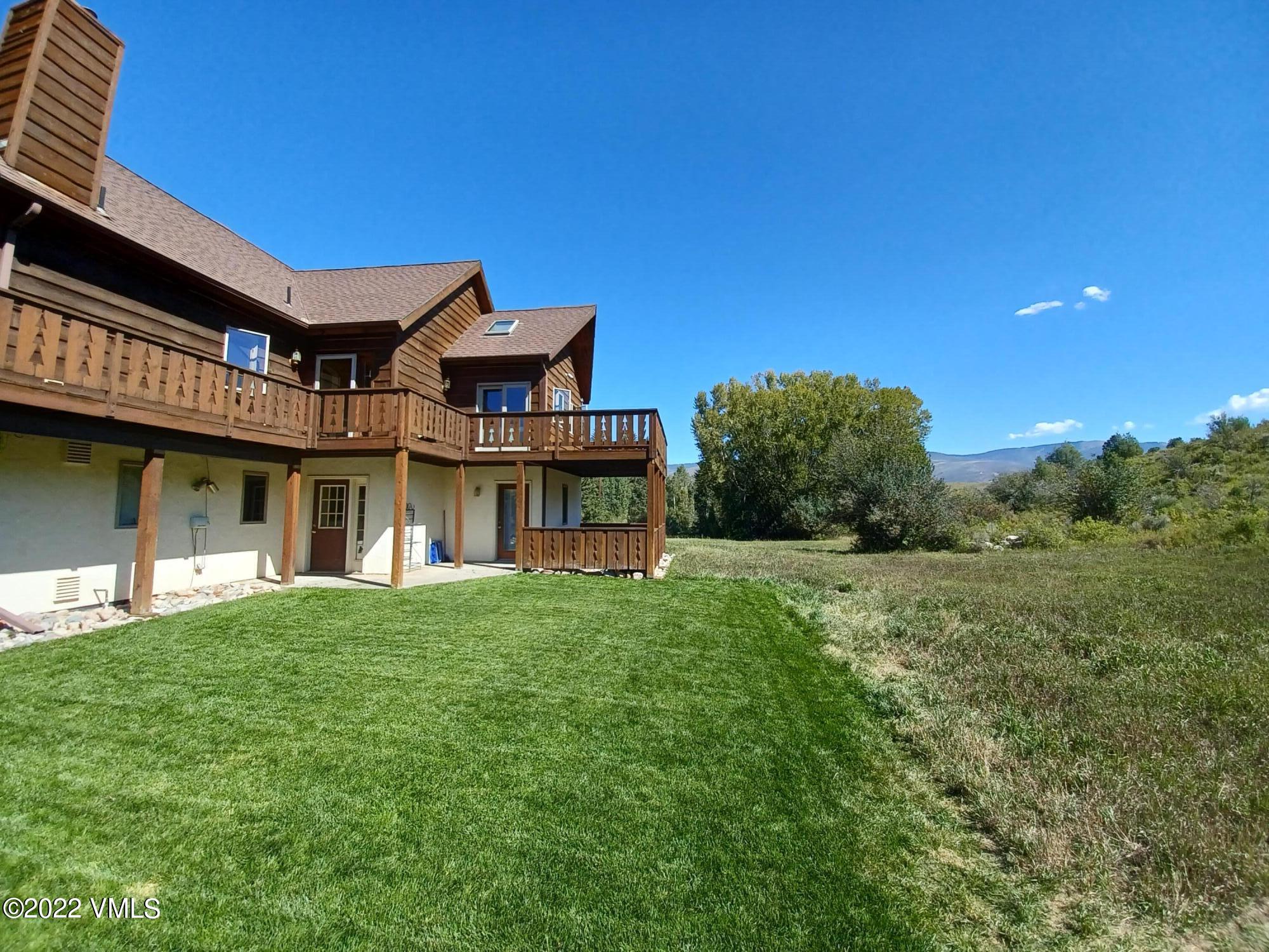 1476 Lake Creek Road Edwards, CO 81632 - Photo 5 of 35 a view of a house with a big yard
