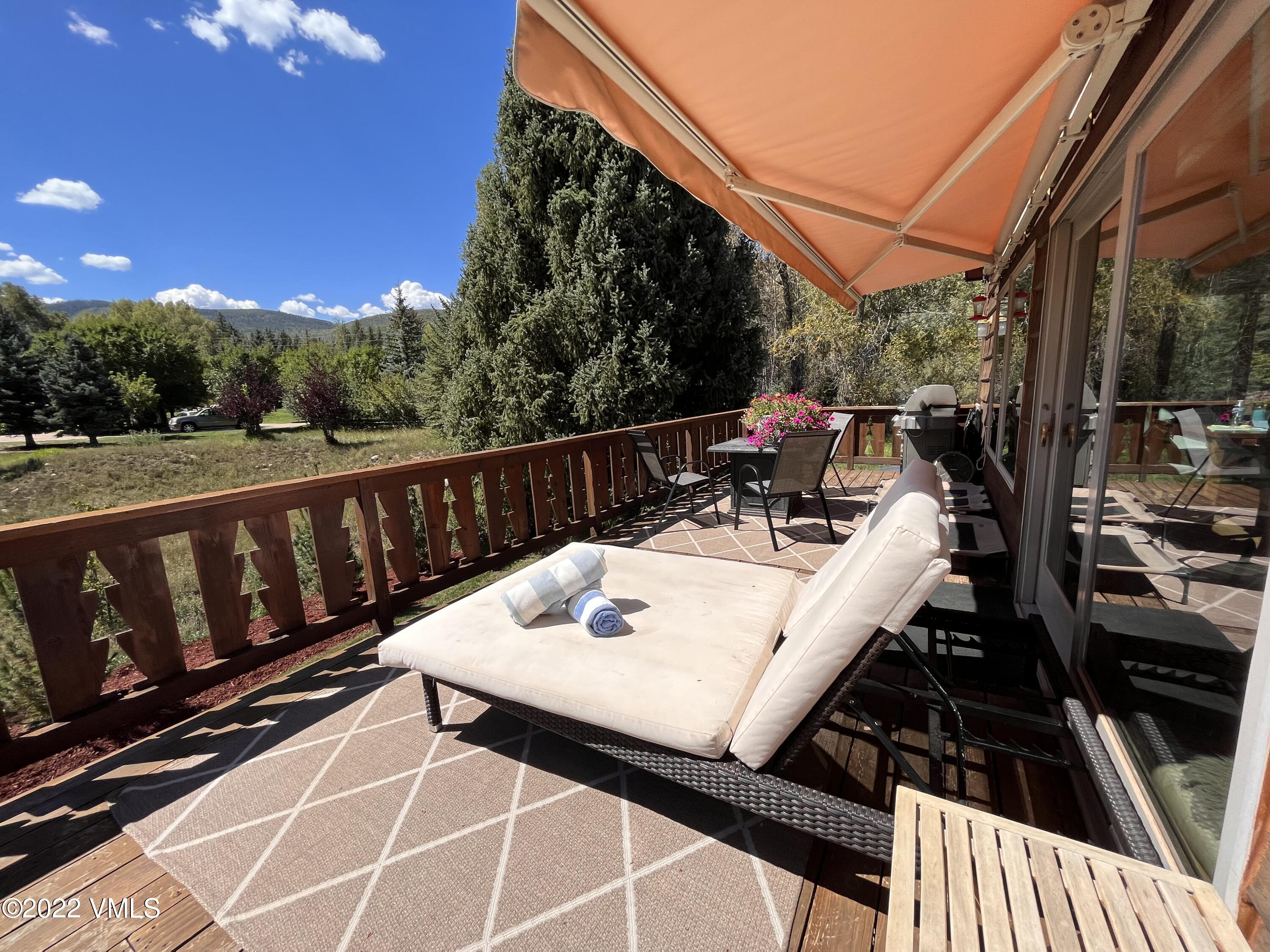1476 Lake Creek Road Edwards, CO 81632 - Photo 6 of 35 a view of a balcony with wooden floor and outdoor seating