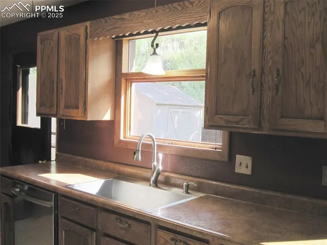 a kitchen with a sink and a window