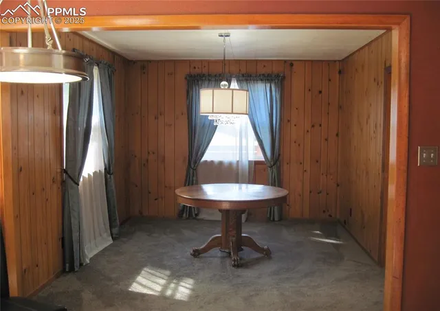 a room with a table and chairs