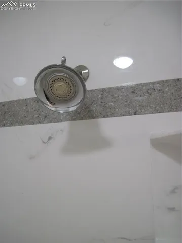 a close view of a sink and a cabinet in a kitchen