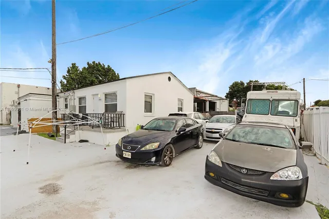 a car parked in front of a house