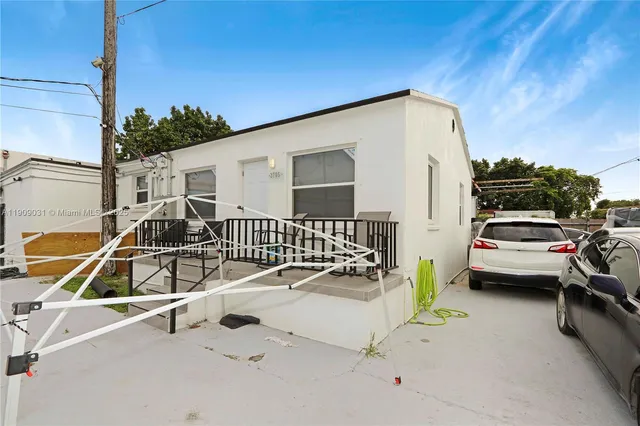 a view of a patio with a table and chairs