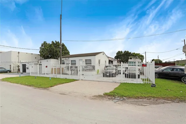 a view of a street with a cars park