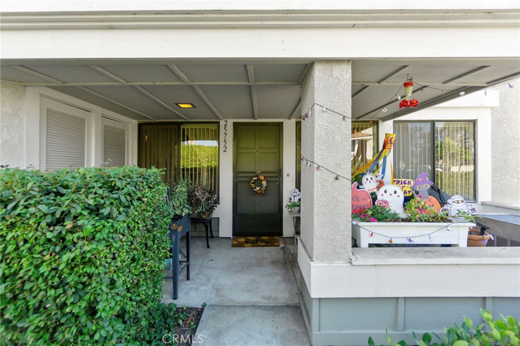 25752 View Pointe, Unit 3B Lake Forest, CA 92630 - Photo 3 of 22 a front view of a house with a garage