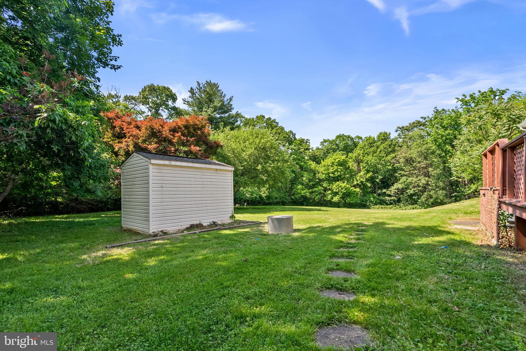 24000 Clarksburg Road Clarksburg, MD 20871 - Photo 57 of 60 a backyard of a house with lots of green space and garden