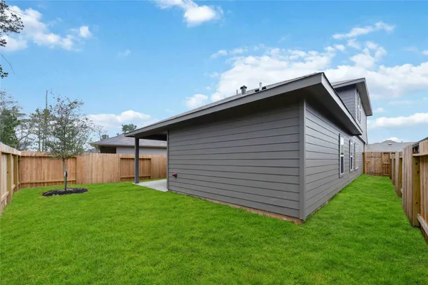 a backyard of a house with lots of green space