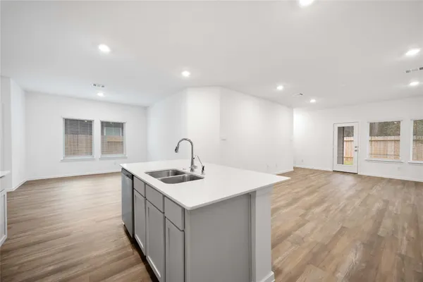 a kitchen that has a sink and a stove in it