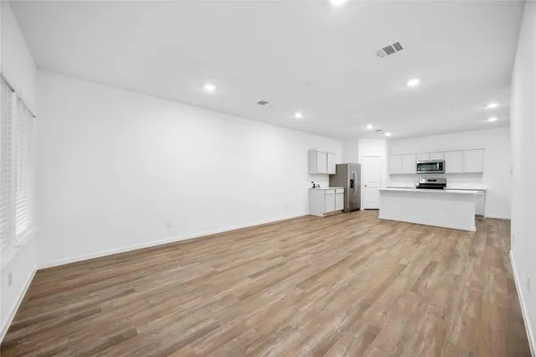 a view of kitchen with wooden floor
