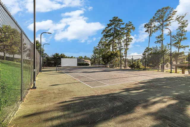 a view of yard with yellow lighting