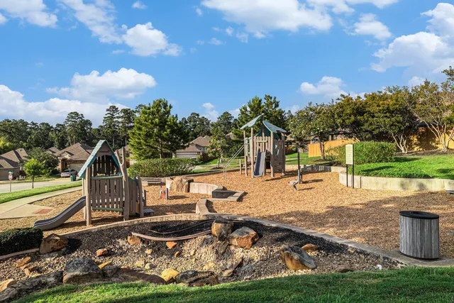 a view of a backyard with sitting area
