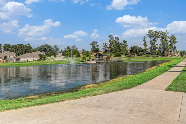 a view of a lake with a yard