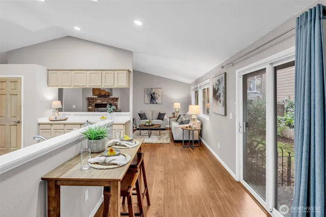 a living room with furniture windows and wooden floor