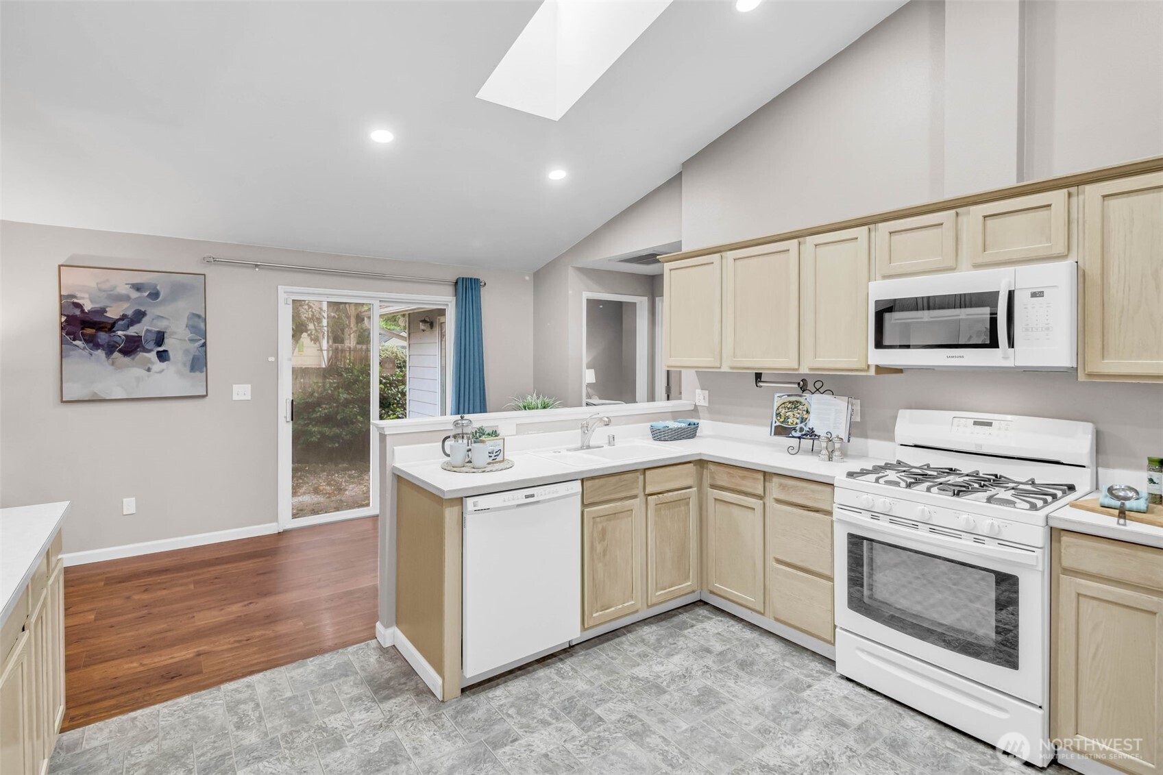 3212 200th Place Southeast Bothell, WA 98012 - Photo 14 of 40 a kitchen with a stove sink and microwave