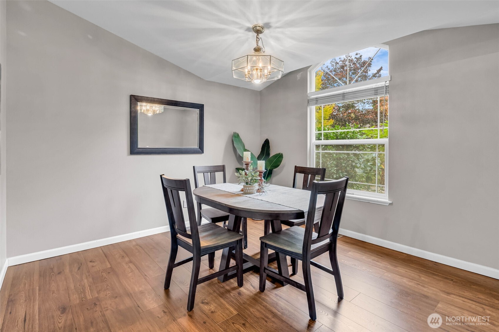 3212 200th Place Southeast Bothell, WA 98012 - Photo 16 of 40 a view of a dining room with furniture window and wooden floor