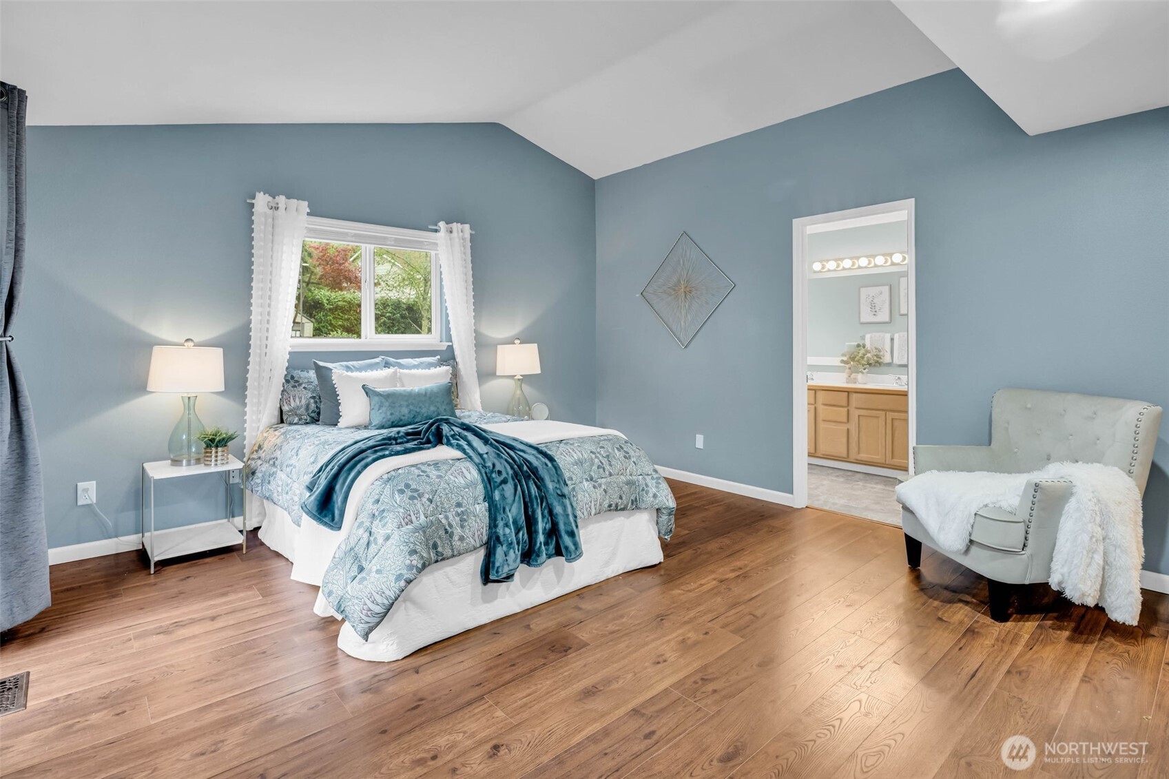 3212 200th Place Southeast Bothell, WA 98012 - Photo 20 of 40 a bedroom with a bed and wooden floor