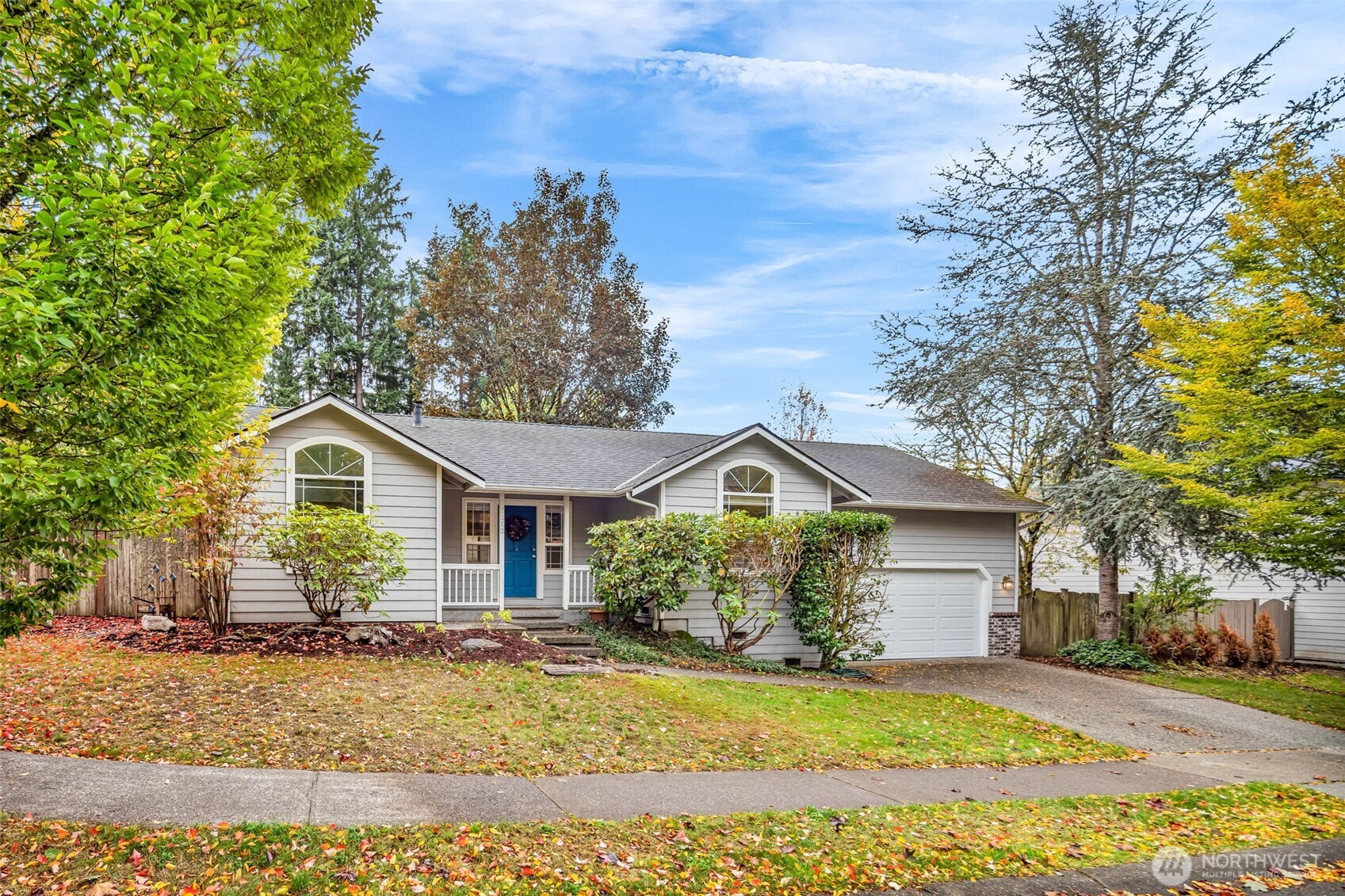 3212 200th Place Southeast Bothell, WA 98012 - Photo 2 of 40 a view of a yard in front of a house with large trees