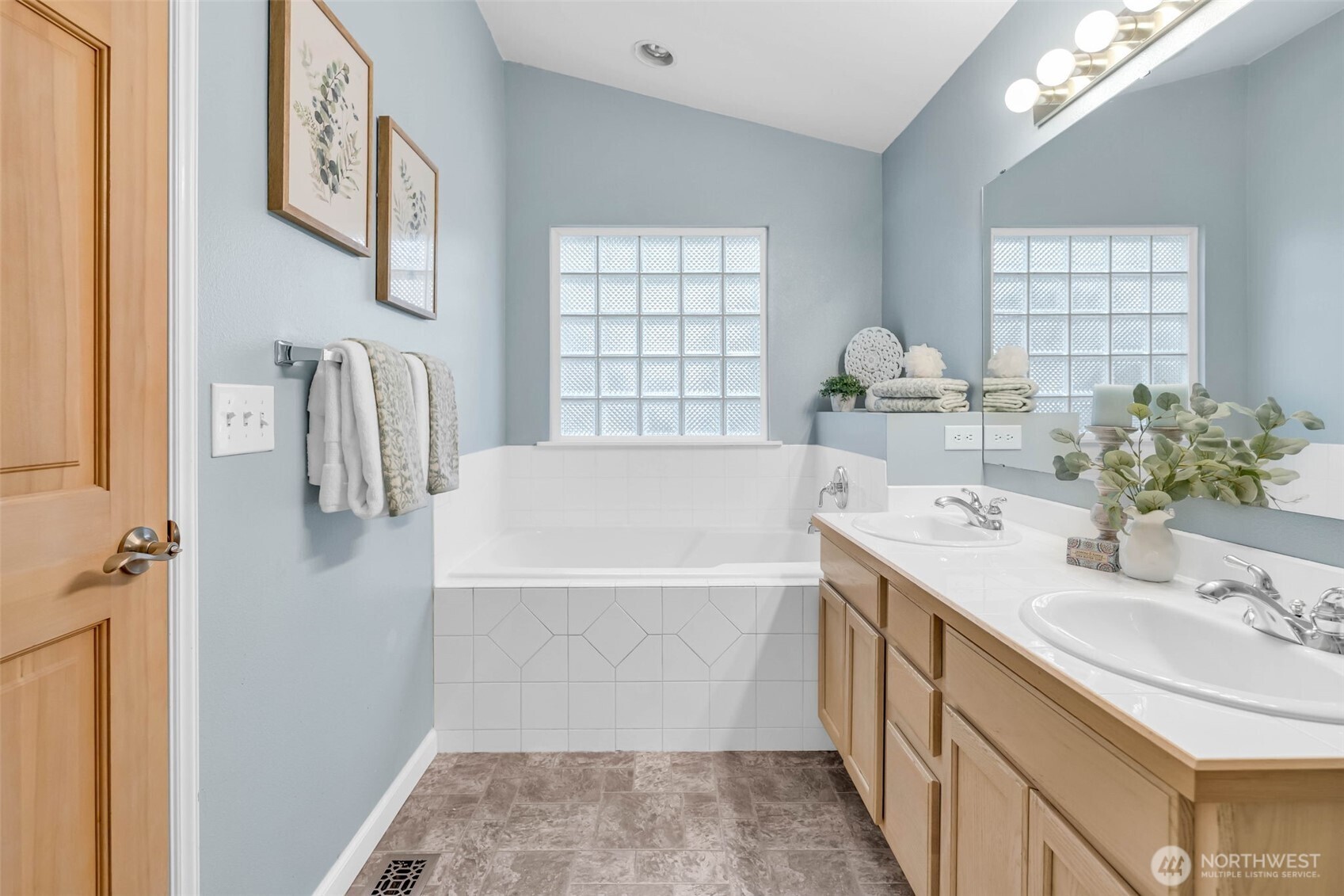 3212 200th Place Southeast Bothell, WA 98012 - Photo 24 of 40 a bathroom with a tub sink and mirror