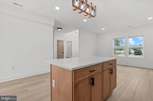 a kitchen with a counter space a sink and appliances