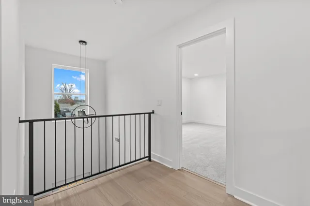 a view of a hallway with windows