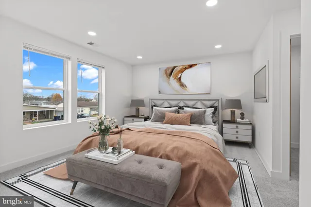 a bedroom with bed and window