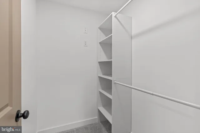 a view of an empty walk in closet