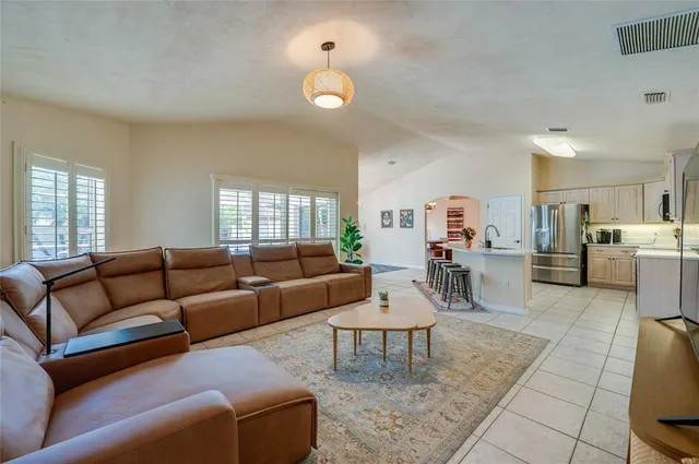 a living room with furniture and a rug