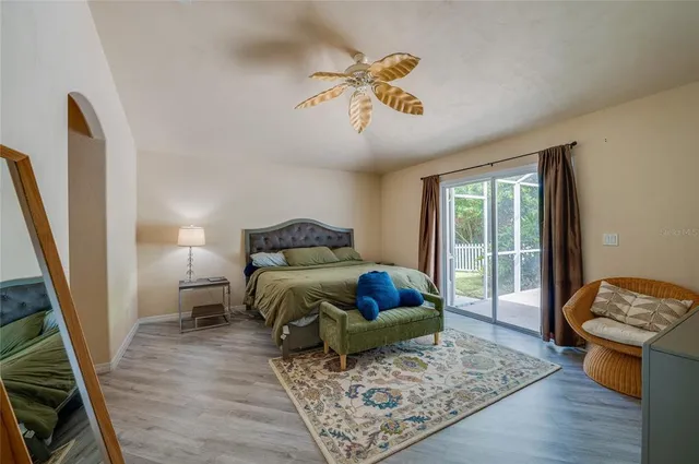 a spacious bathroom with a tub sink and mirror