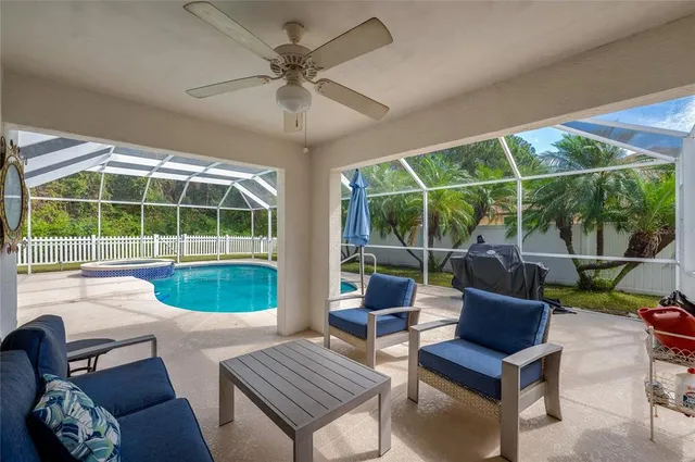 a swimming pool with barbeque oven in front of it