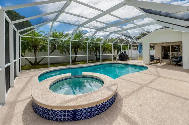 a view of a patio with a table and chairs