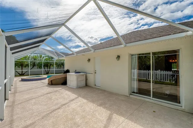 a view of a house with a yard and sitting area