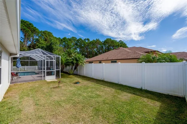 an aerial view of a house with a garden