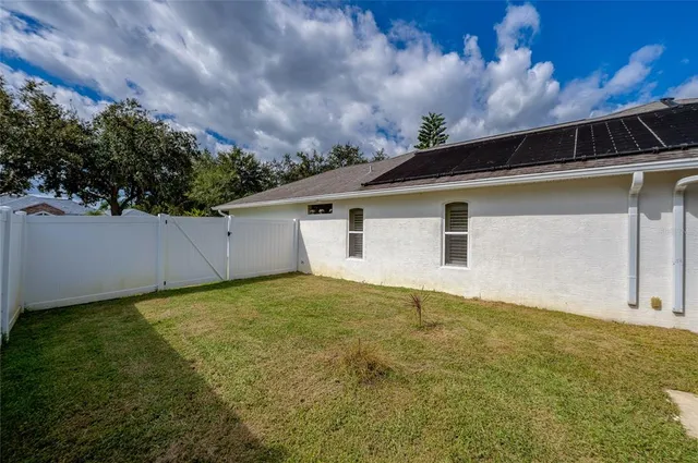an aerial view of a house with garden space sitting space and swimming pool