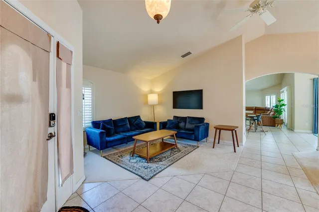 a view of a livingroom with furniture and a chandelier