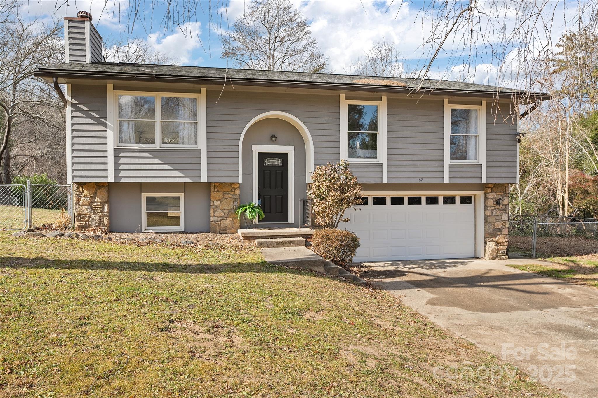 67 Overlook Road Asheville, NC 28803 - Photo 1 of 25 a front view of a house with garden
