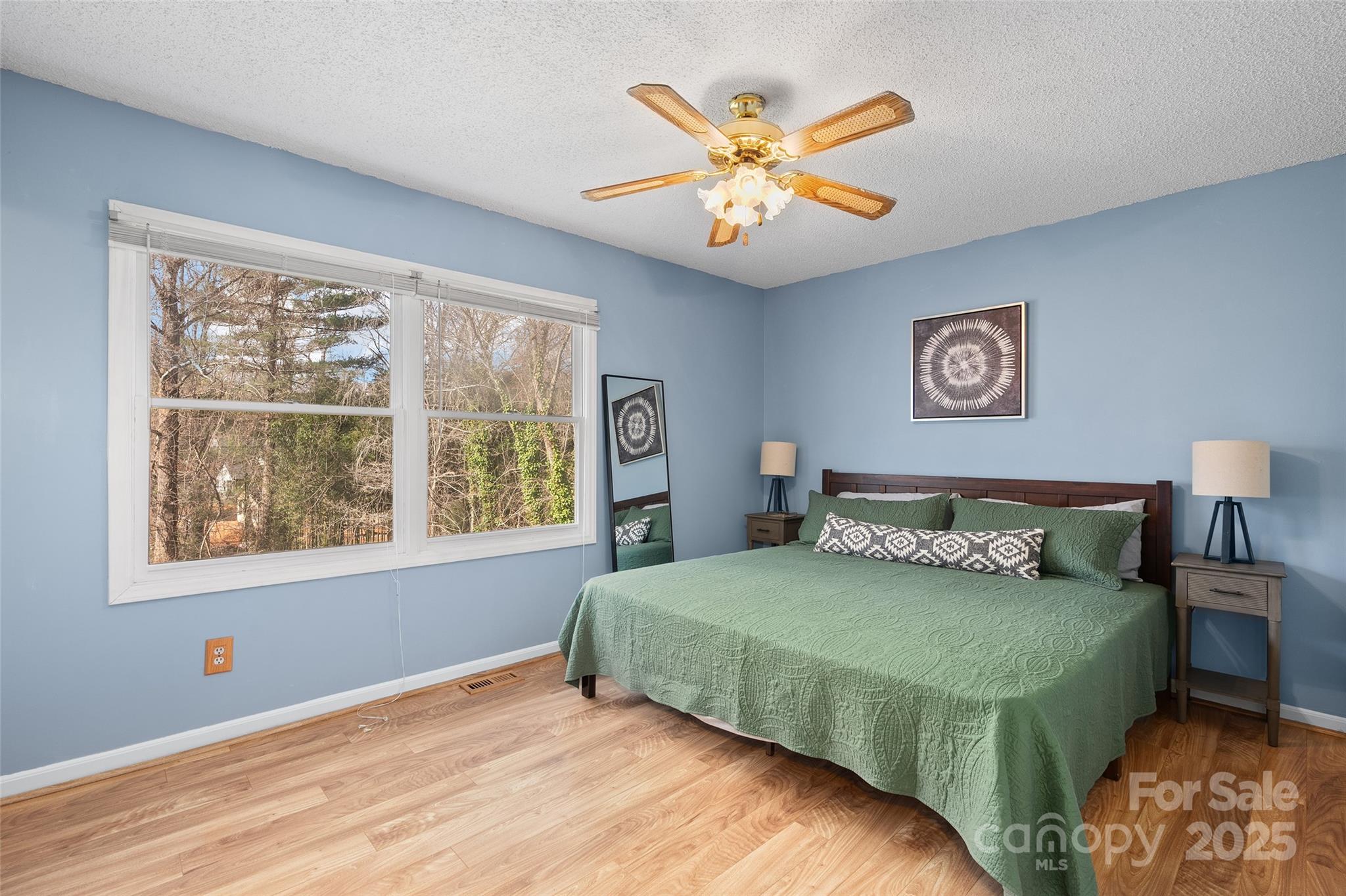 67 Overlook Road Asheville, NC 28803 - Photo 12 of 25 a bedroom with a large bed and a window