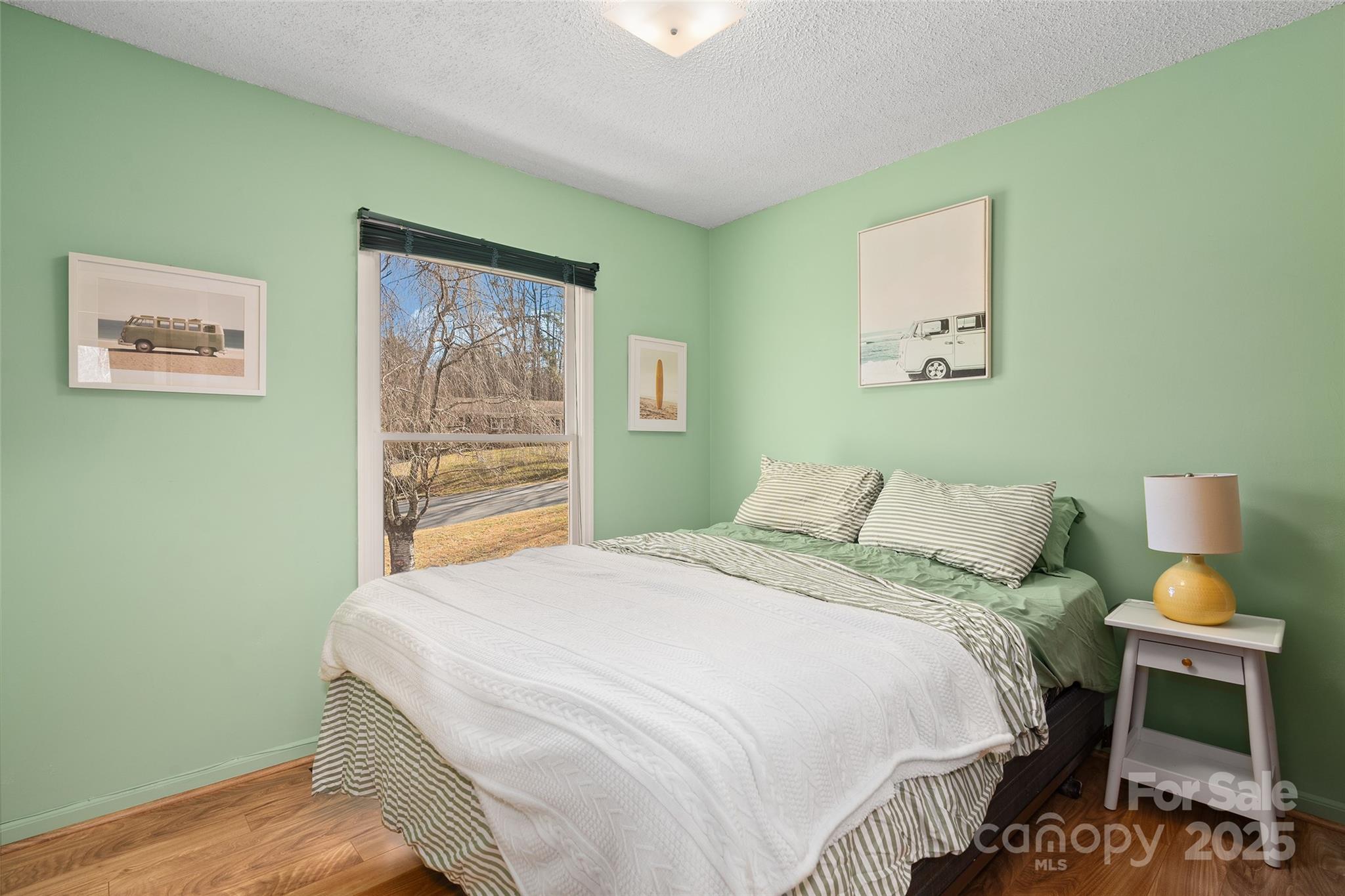 67 Overlook Road Asheville, NC 28803 - Photo 15 of 25 a bedroom with a bed and a window