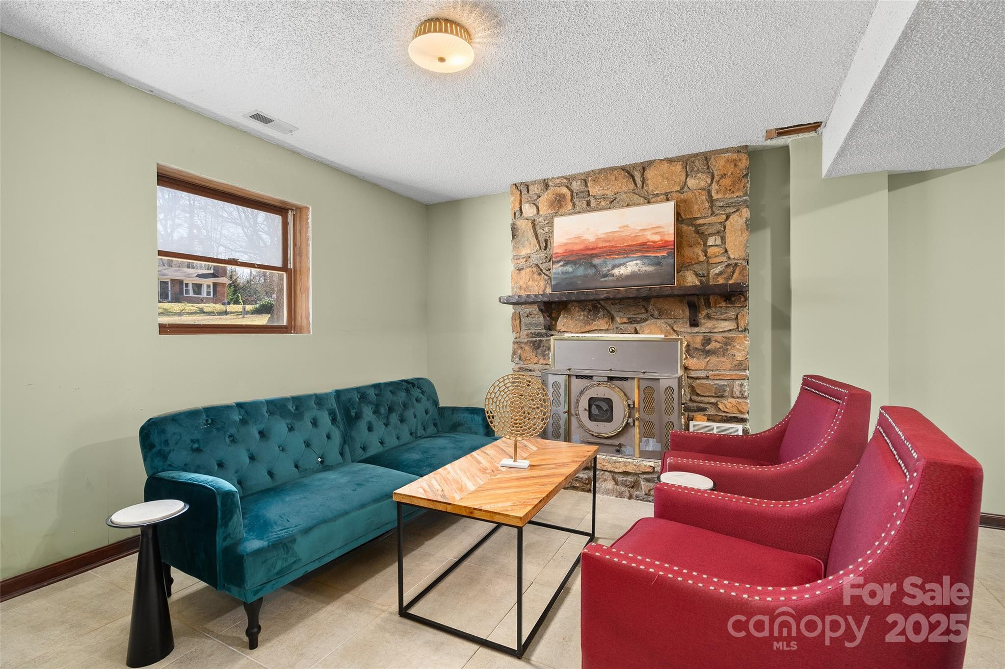 67 Overlook Road Asheville, NC 28803 - Photo 20 of 25 a living room with furniture and a flat screen tv