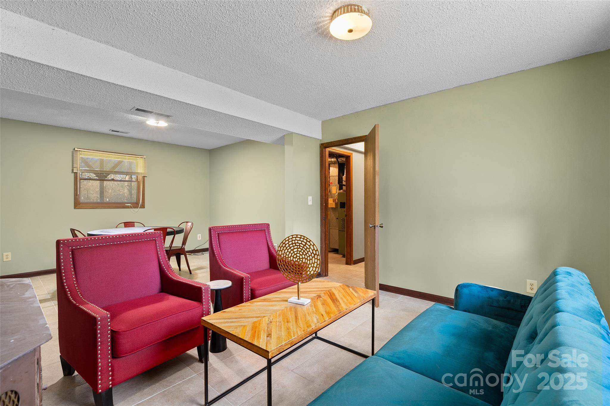 67 Overlook Road Asheville, NC 28803 - Photo 22 of 25 a living room with furniture and a wooden floor