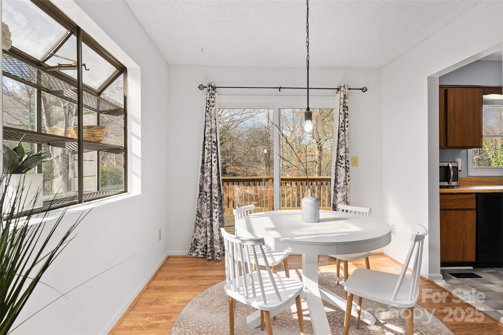 67 Overlook Road Asheville, NC 28803 - Photo 8 of 25 a view of a dining room with furniture window and outside view