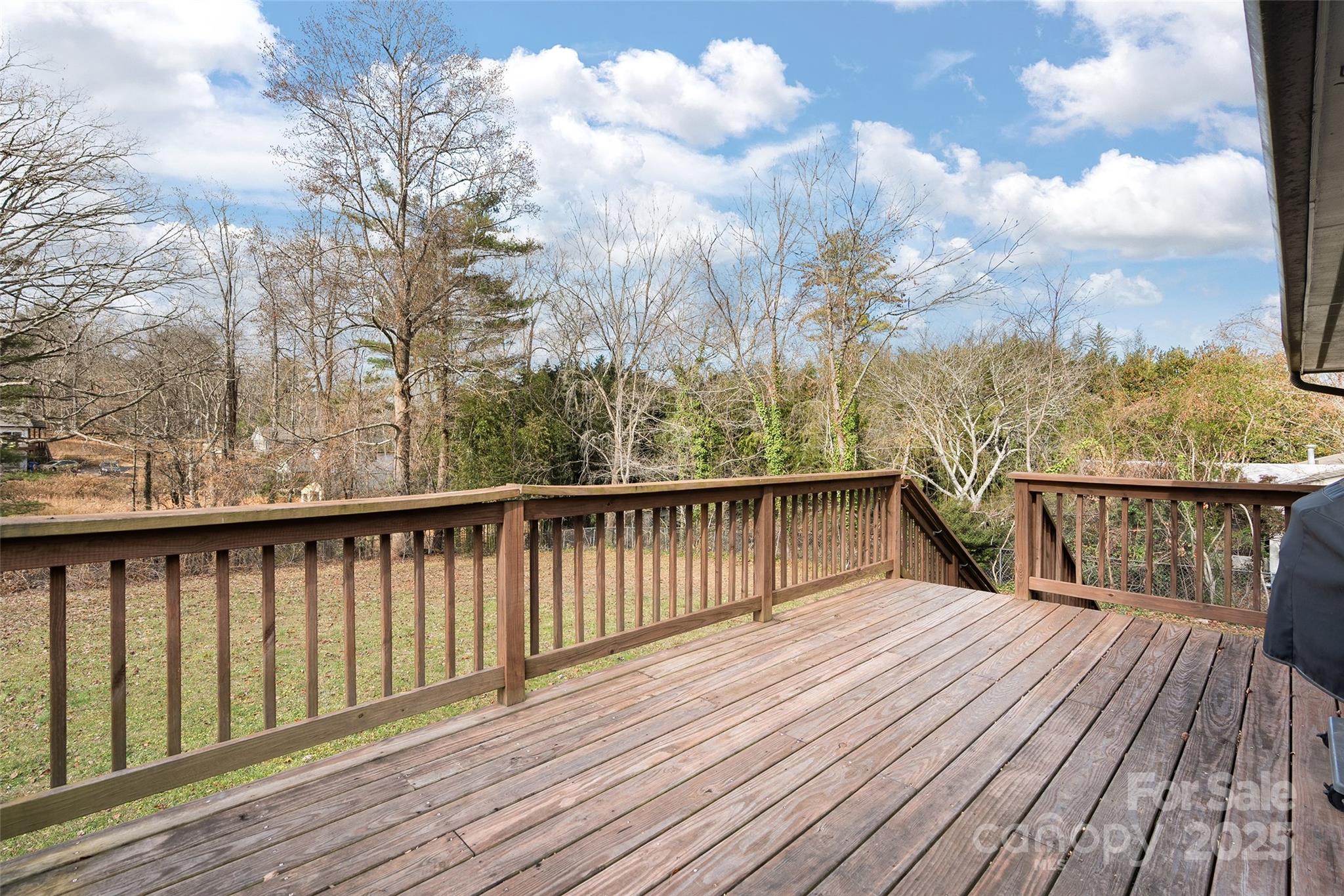 67 Overlook Road Asheville, NC 28803 - Photo 9 of 25 a balcony with wooden floor and fence