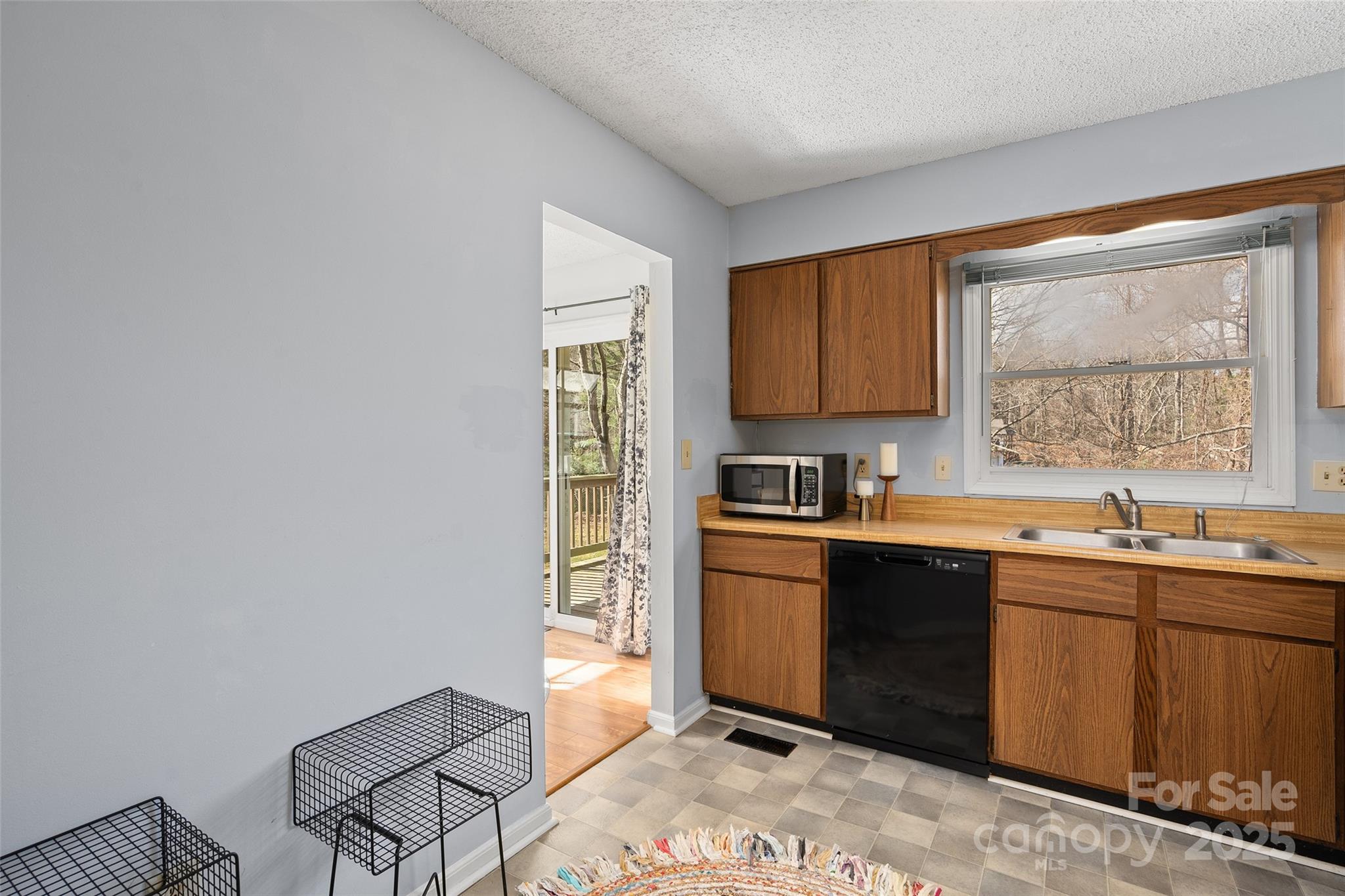 67 Overlook Road Asheville, NC 28803 - Photo 10 of 25 a kitchen with a sink cabinets and window