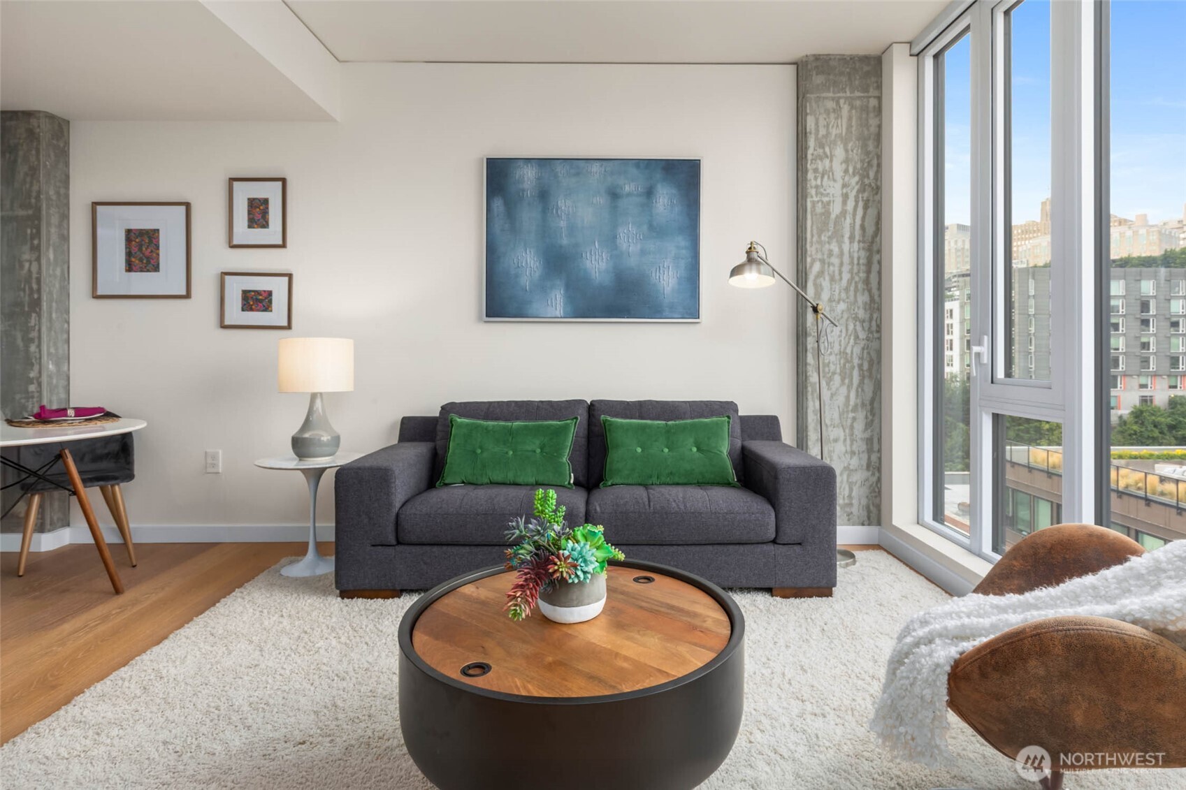 450 South Main Street, Unit 903 Seattle, WA 98104 - Photo 2 of 25 a living room with furniture and a large window