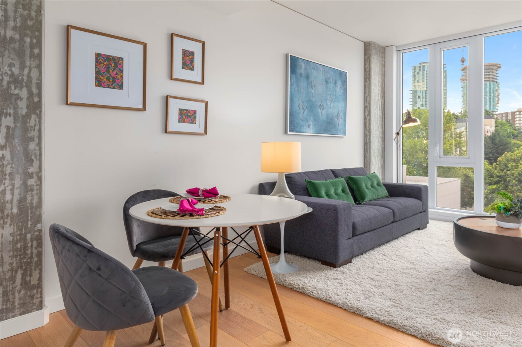 450 South Main Street, Unit 903 Seattle, WA 98104 - Photo 3 of 25 a living room with furniture and a potted plant