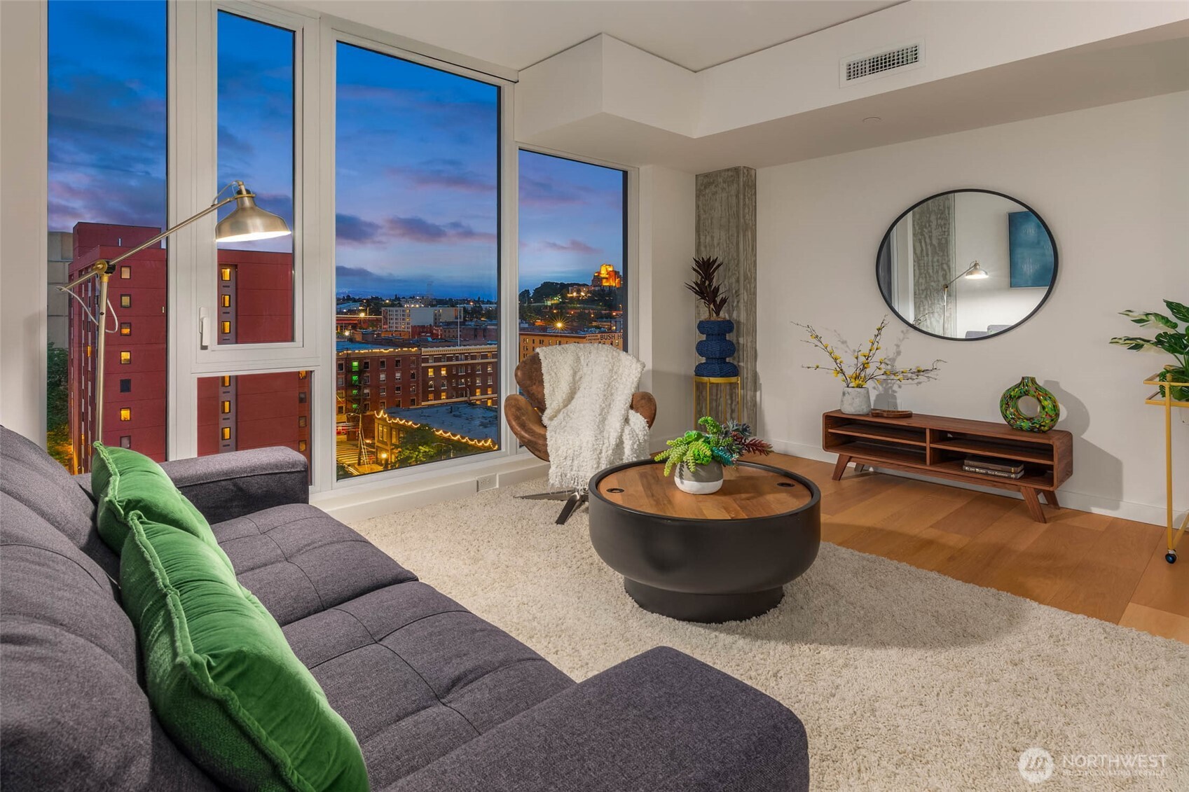 450 South Main Street, Unit 903 Seattle, WA 98104 - Photo 5 of 25 a living room with furniture and a fireplace