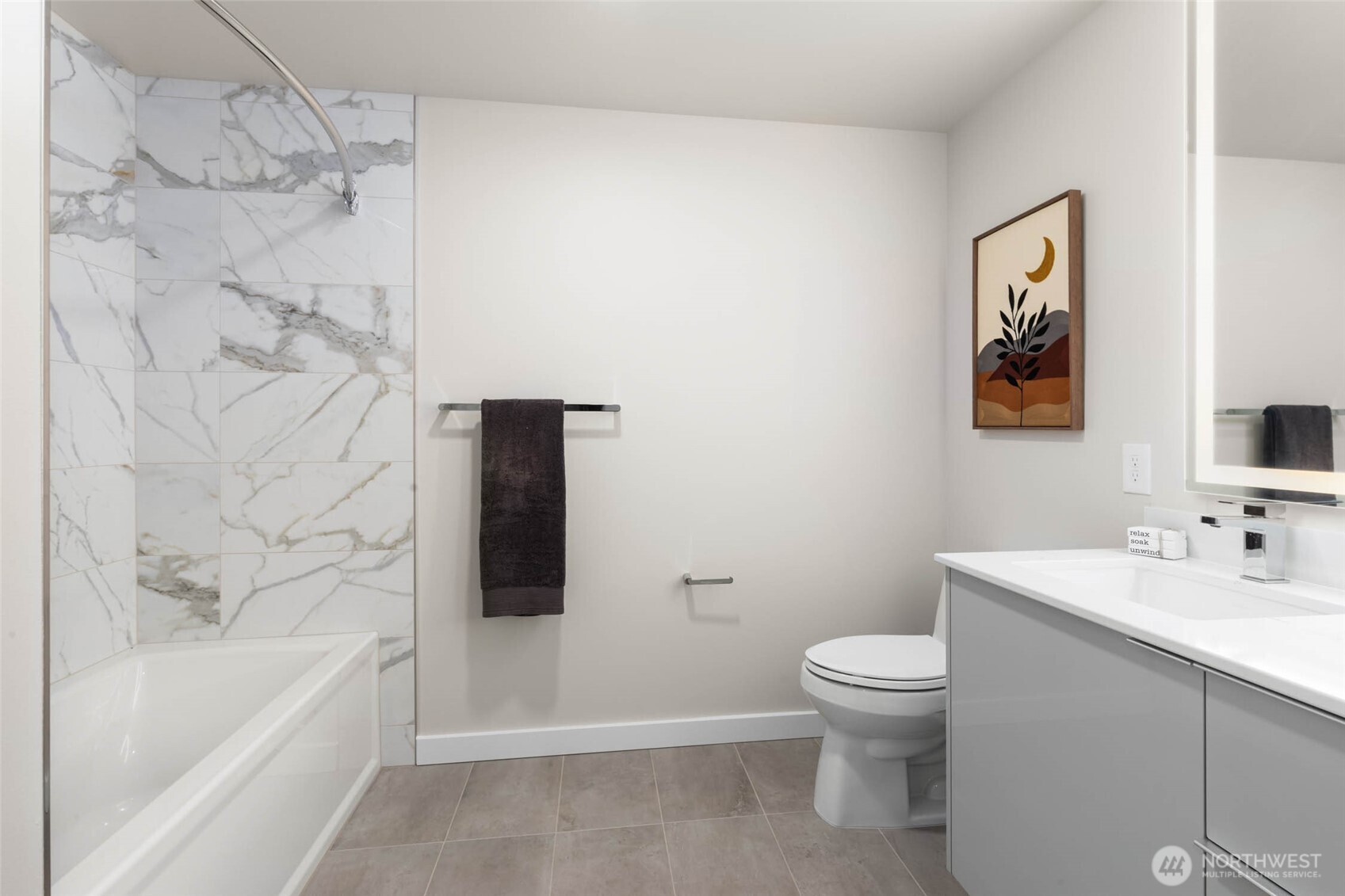 450 South Main Street, Unit 903 Seattle, WA 98104 - Photo 10 of 25 a bathroom with a bathtub and a toilet