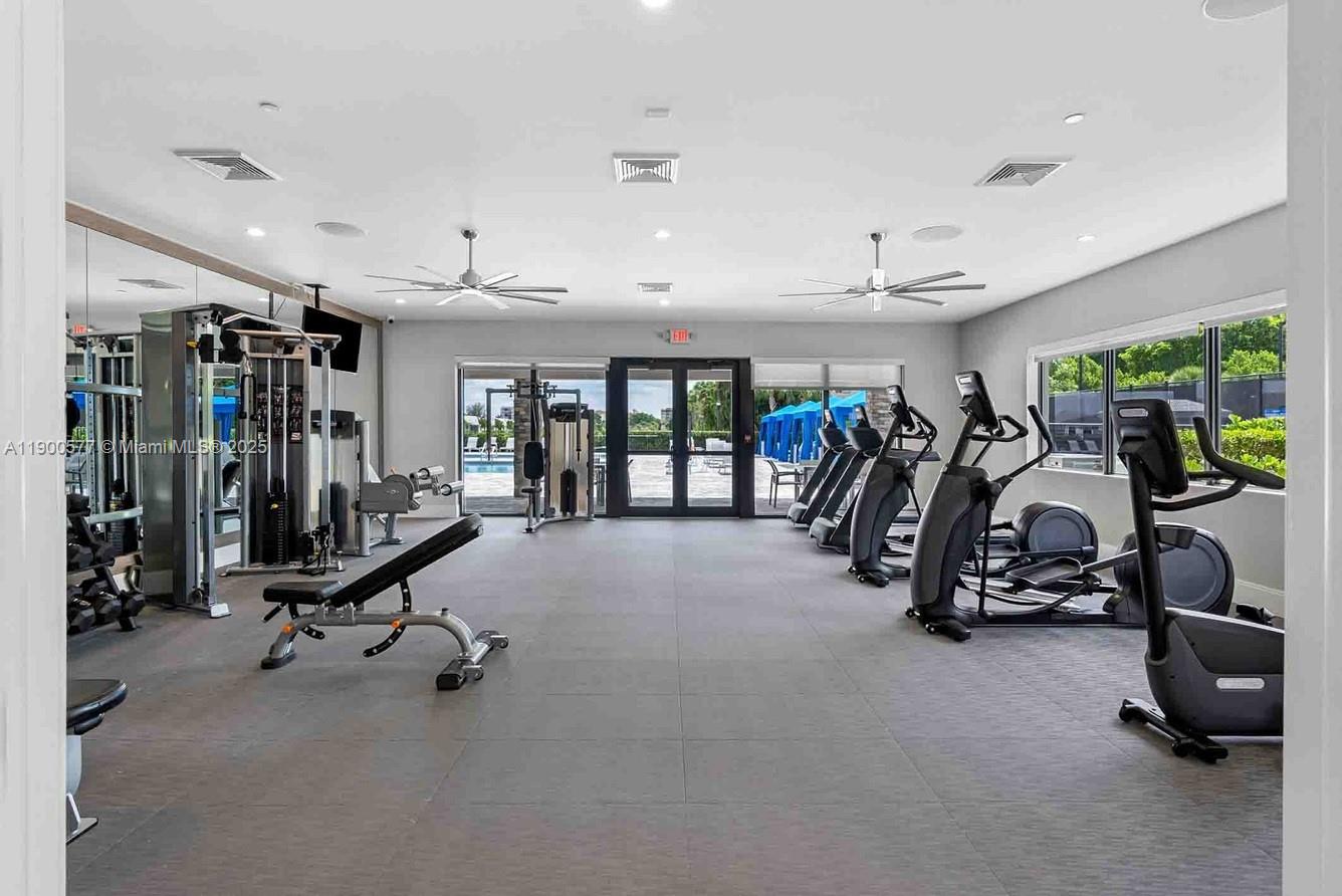 14502 Sloan Rdg Drive, Unit LUMINOSA Delray Beach, FL 33446 - Photo 15 of 49 a view of a room with gym equipment