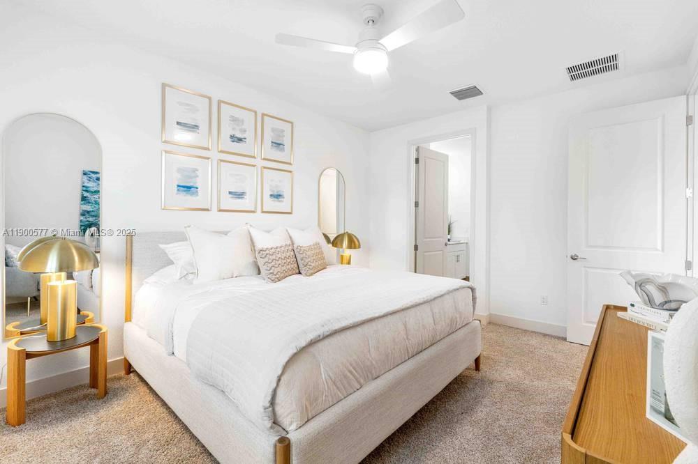 14502 Sloan Rdg Drive, Unit LUMINOSA Delray Beach, FL 33446 - Photo 43 of 49 a bed room with a bed and a chair