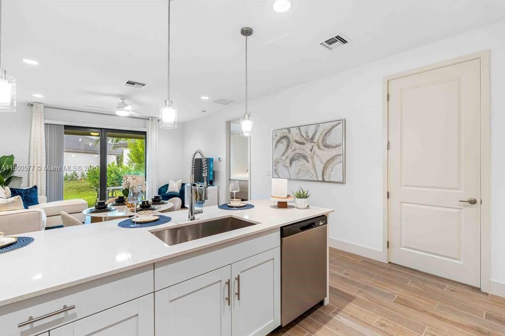 14502 Sloan Rdg Drive, Unit LUMINOSA Delray Beach, FL 33446 - Photo 45 of 49 a kitchen with sink and window